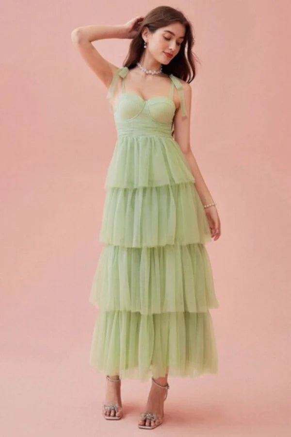 ethereal," "whimsical," "romantic," "A-line silhouette," "sweetheart neckline," "ruched," "cascading layers," "garden party," "special occasion