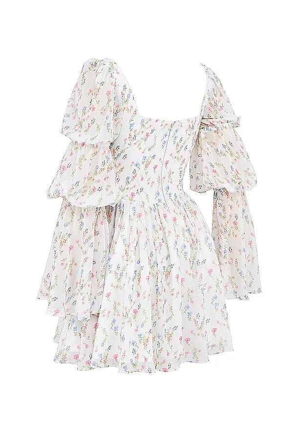 Model wearing the Kouvr Fashion white floral puff sleeve mini dress