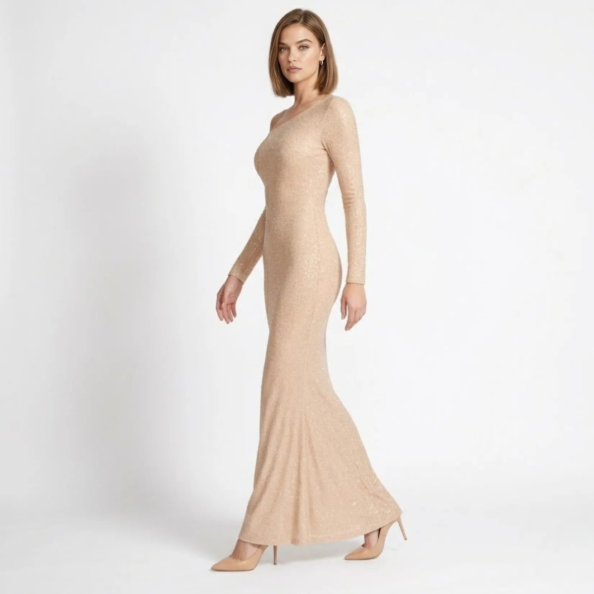 Elegant champagne sparkly bodycon evening gown side profile view showing tailored silhouette