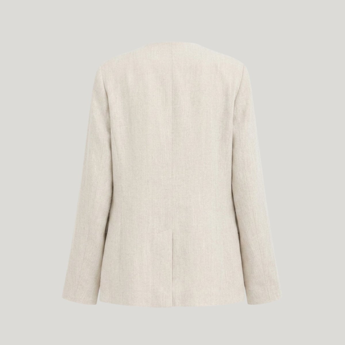 Flat lay ghost mannequin back view of a beige lightweight summer blazer showcasing seaming.