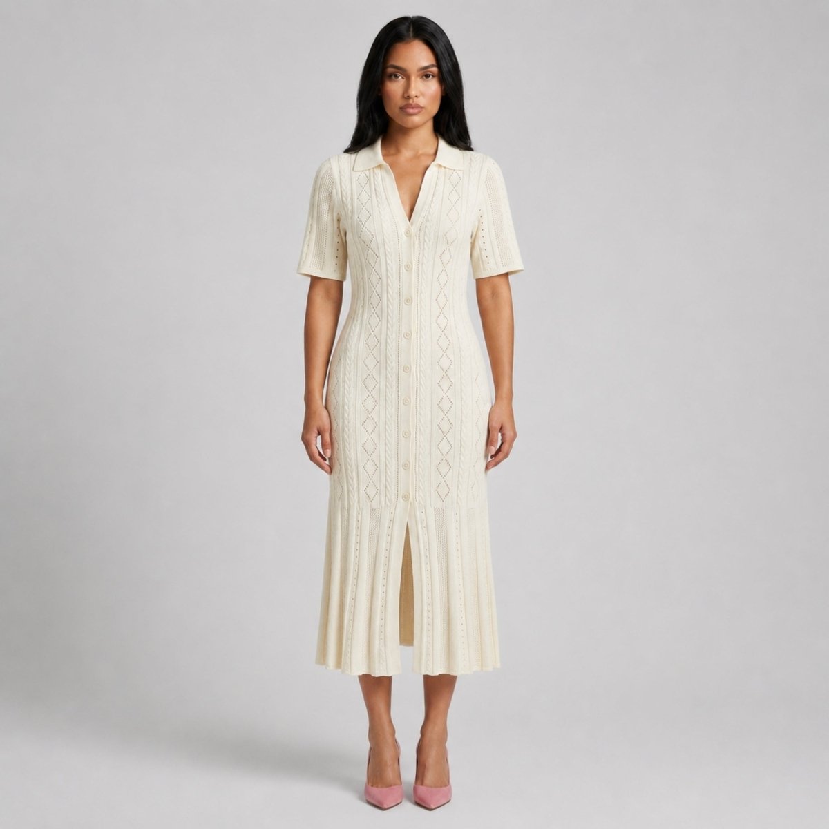 Woman wearing Kouvr cream ribbed knit button down polo midi dress with flared hem facing forward.