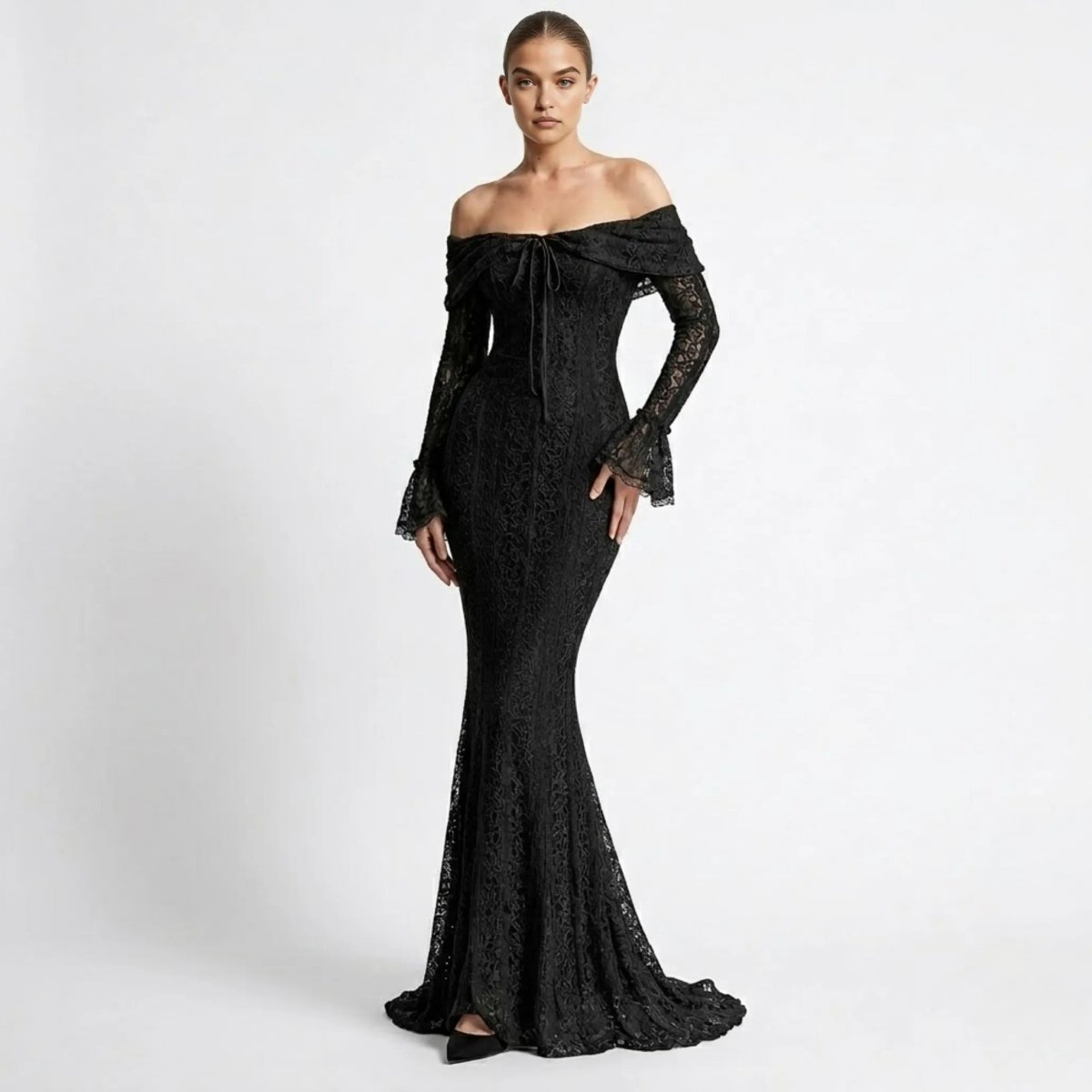 Front view of female model wearing an elegant black lace off the shoulder maxi dress with long bell sleeves