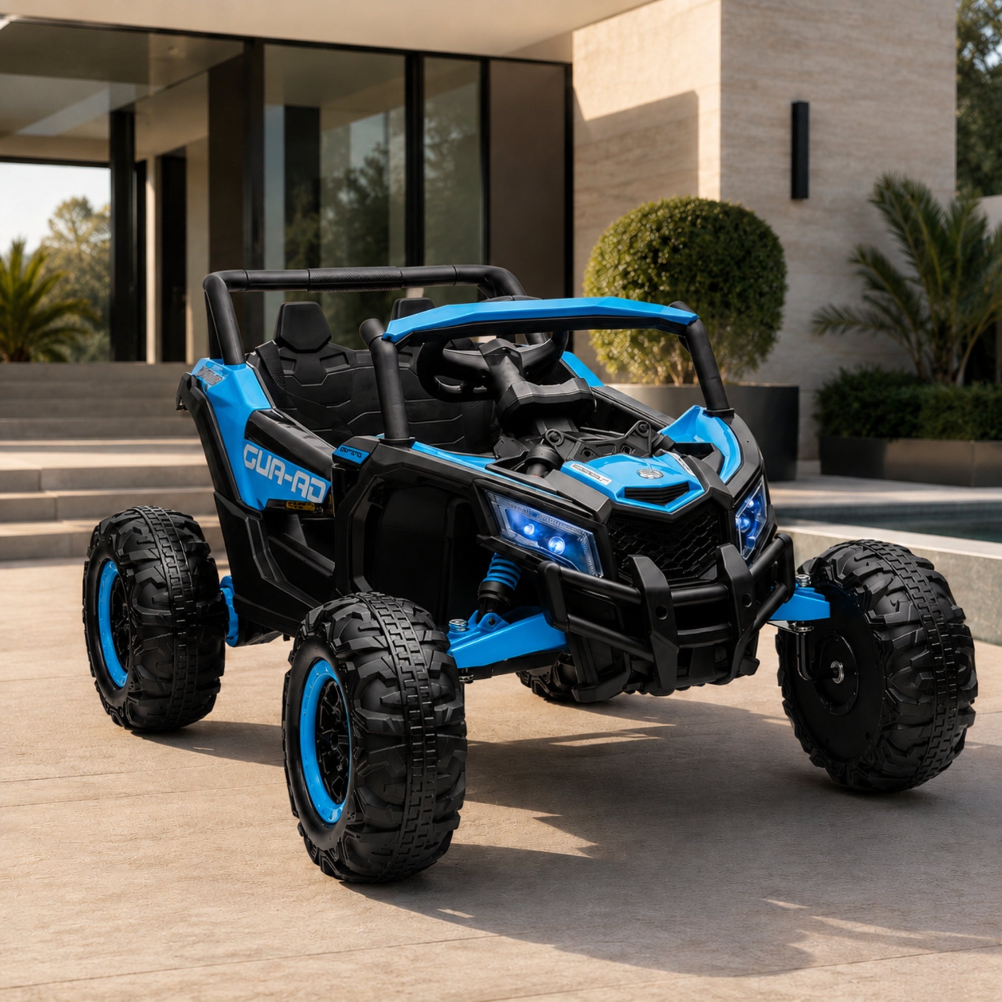 A vibrant blue 4x4 battery-powered toy truck for kids showcasing oversized off-road wheels and bright headlights on an outdoor patio.