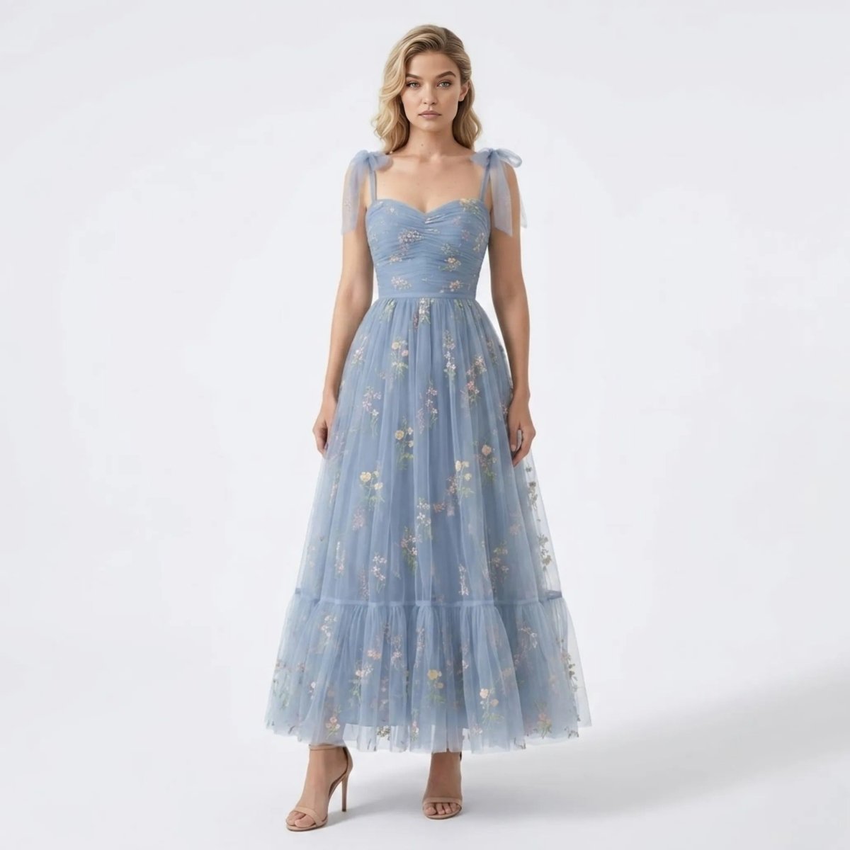 Front view of the Kouvr blue floral embroidered tulle maxi dress featuring sheer tie straps and a sweetheart ruched bodice.