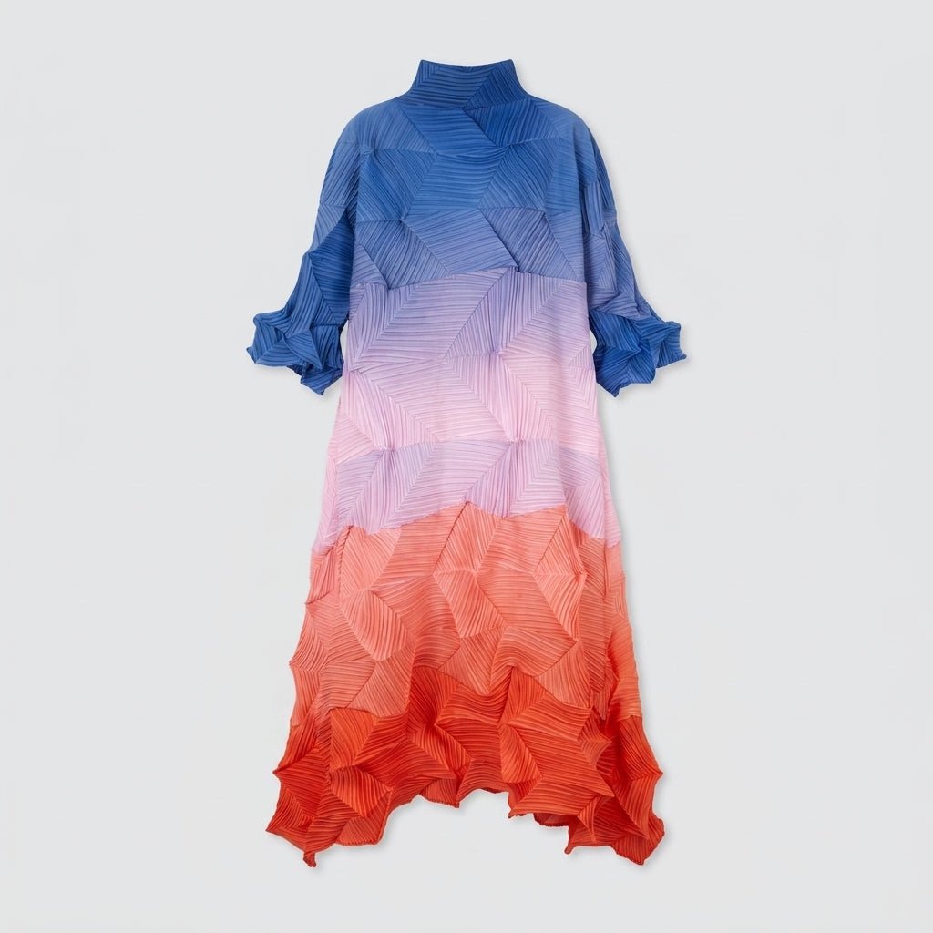 Full body flat lay studio shot of the Kouvr blue to orange ombre pleated long sleeve dress.