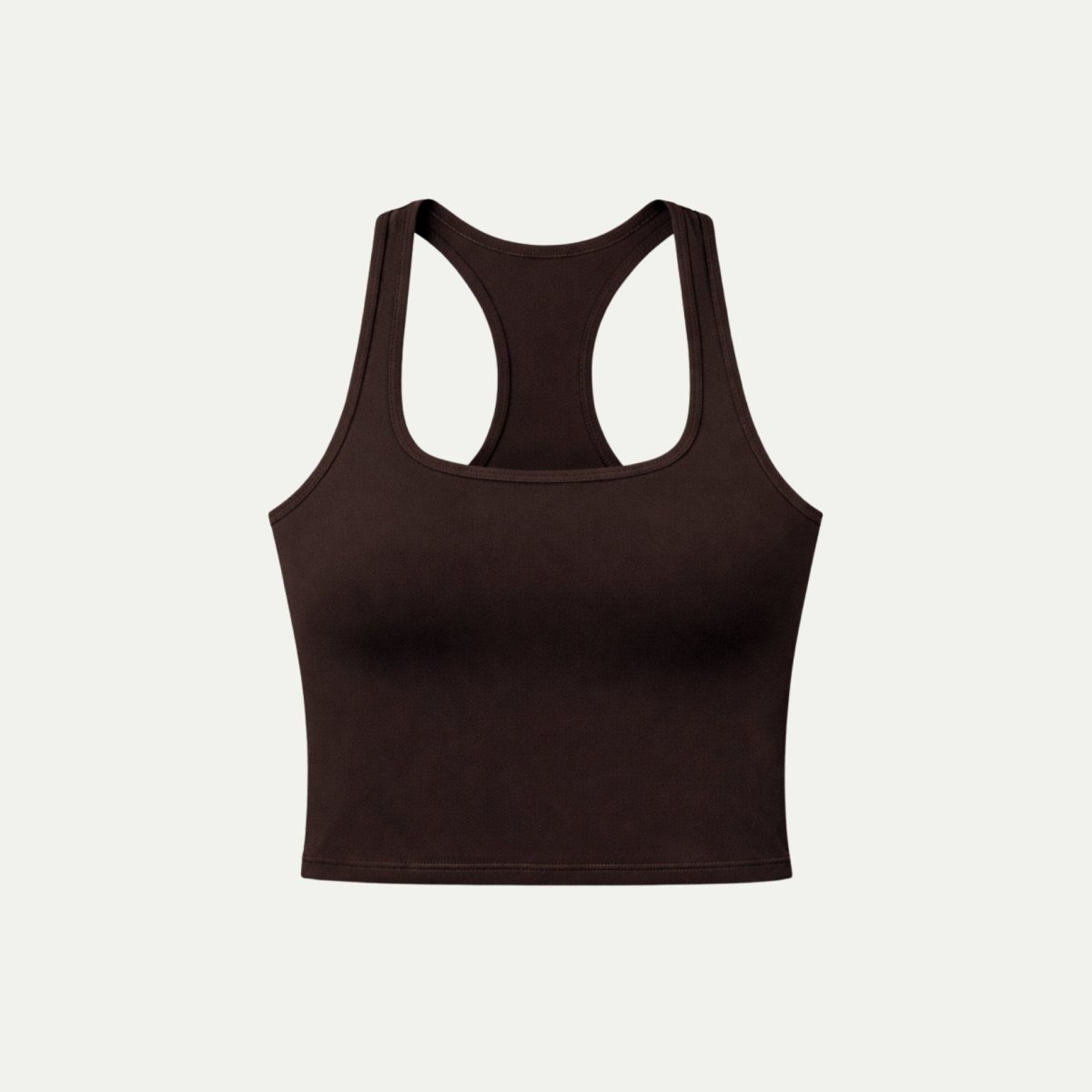 Flat lay of a chocolate brown scoop neck workout crop top on a light background.