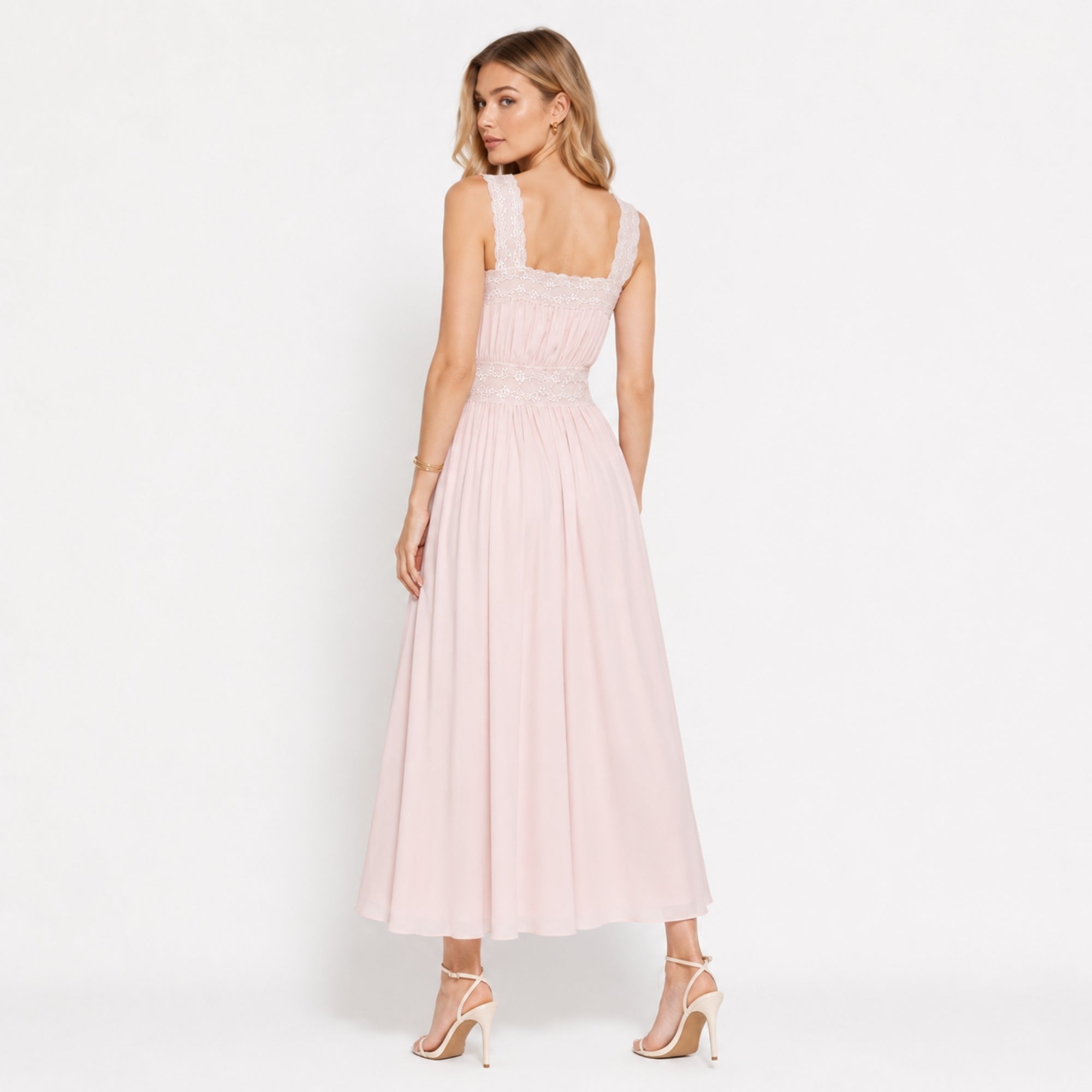 Back view of romantic blush pink garden party dress with wide lace straps and fluid A-line skirt