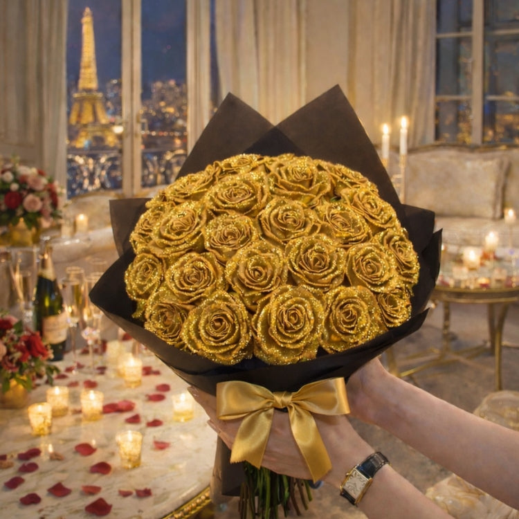 Close-up of a gold glitter rose bouquet with a gold satin ribbon held by a woman. Handmade eternal roses sparkling in the light.