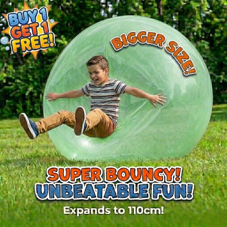 A boy crashing into a giant green inflatable bubble ball, showcasing the super bouncy material and larger size for active outdoor play.