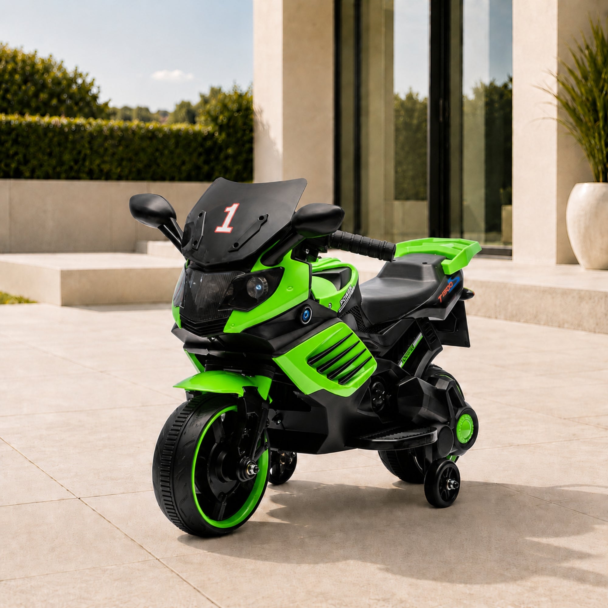 Vibrant green luxury kids 6V electric motorcycle with training wheels parked elegantly on an outdoor patio.