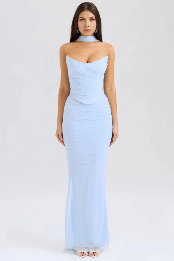 Model wears the Hailey light blue corset prom dress, featuring a draped strapless bodice, ruched mesh maxi skirt, and a choker neck detail, shown from the front.