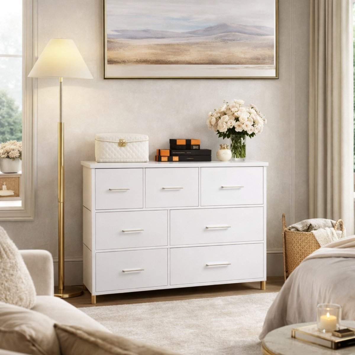 The Kouvr white dresser placed under a landscape painting in a serene bedroom, functioning as a stylish storage solution.