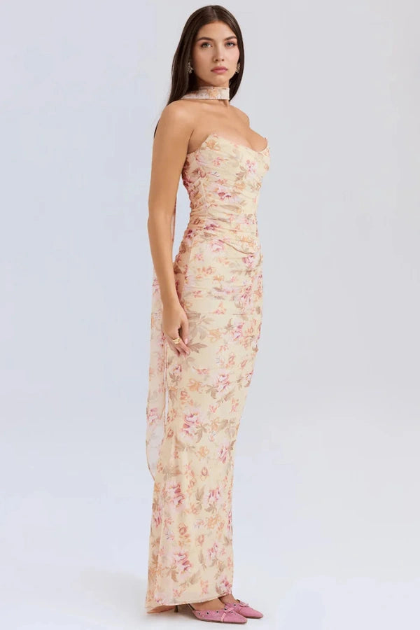 Model wearing the Kouvr Hailey strapless floral corset gown in yellow and pink