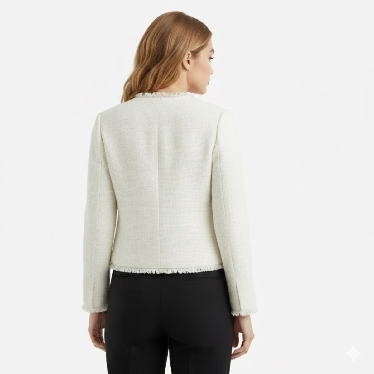 Back view of the Kouvr Jelani white tweed jacket demonstrating the tailored seams and clean silhouette.
