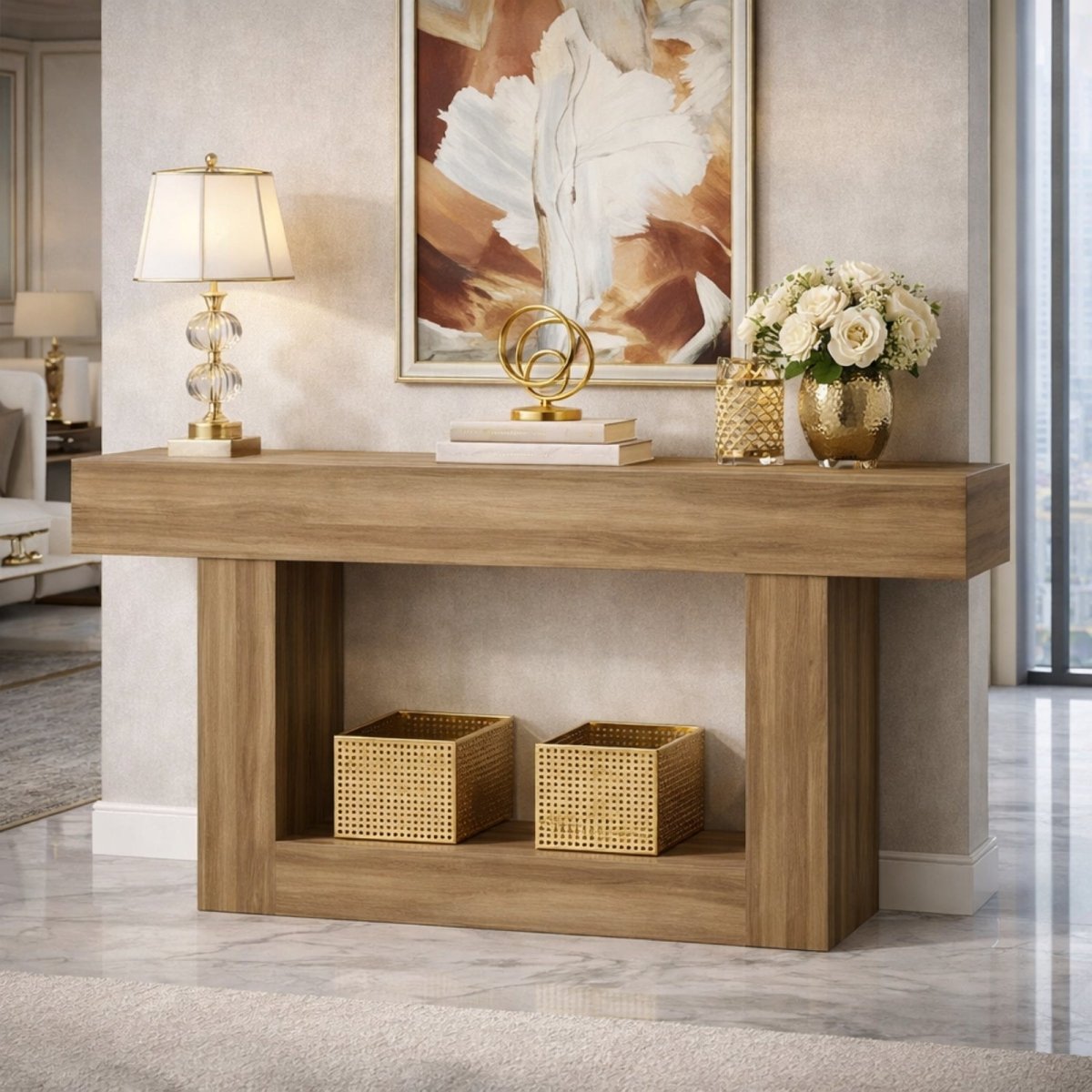 The Acropolis modern oak console table by Kouvr styled in a luxurious entryway with a crystal lamp, gold decor, and abstract art, showcasing its lower storage shelf.