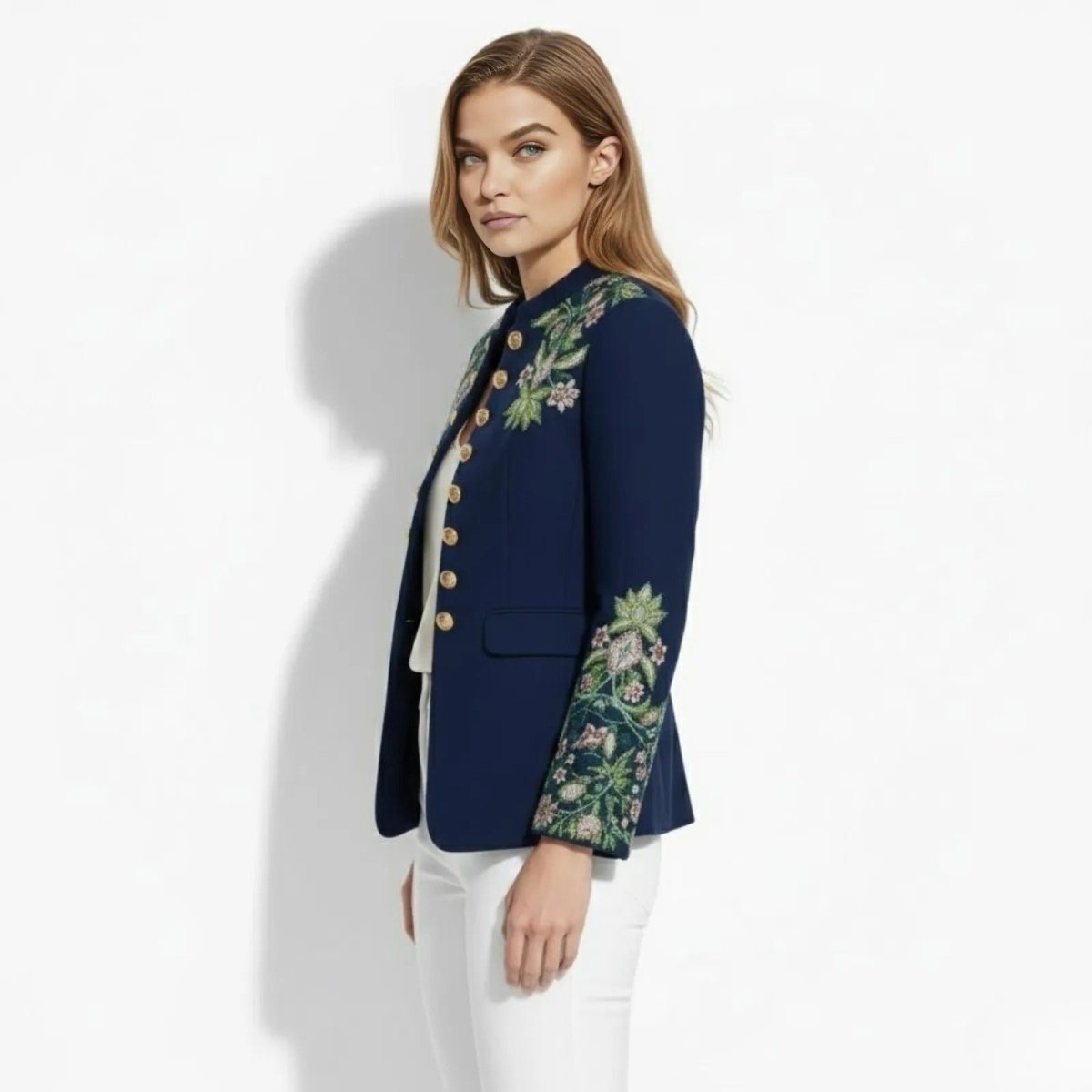 Side view of the Kouvr Aiko green military jacket, highlighting the tailored fit and detailed floral embroidery on the sleeve cuff.