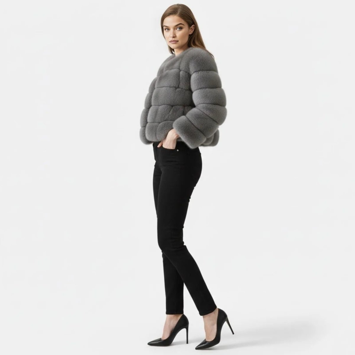 Side profile view of a model in the Alexia grey faux fur paneled jacket, highlighting its voluminous sleeves and cropped fit.