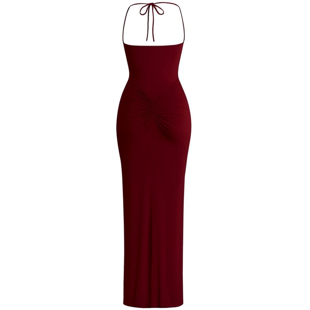 Model wearing Kouvr Fashion Amoura Gown in burgundy showing side mesh panel detail