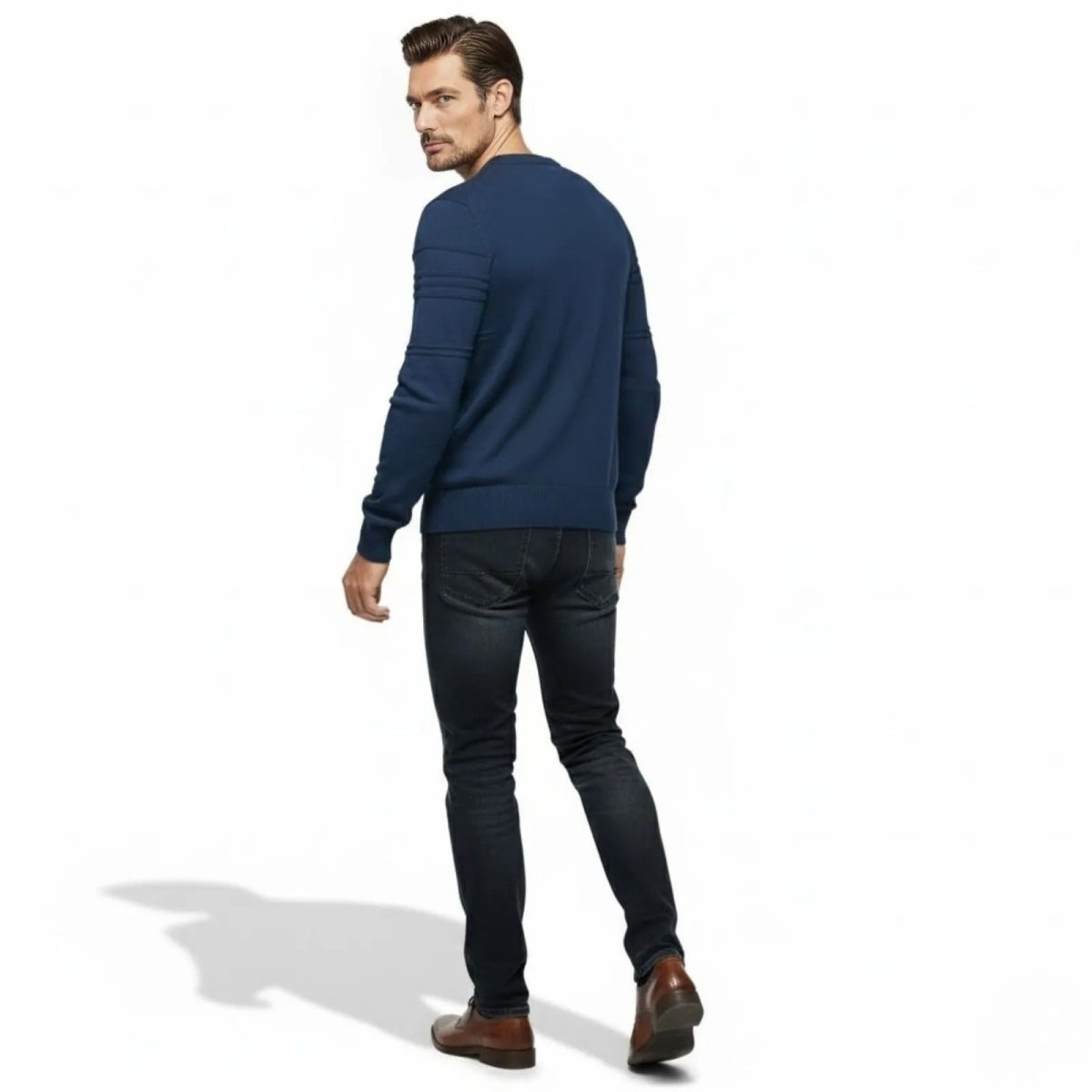 Back view of a man wearing the blue Kouvr Ander sweater, highlighting the clean design and fit.