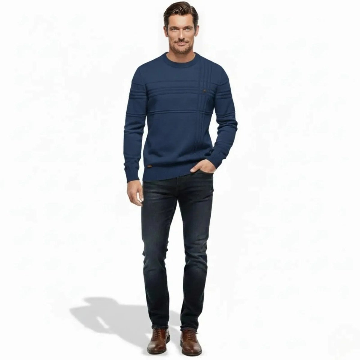 Man wearing the Kouvr Fashion blue Ander Textured Crewneck Sweater with dark wash jeans and brown dress shoes.