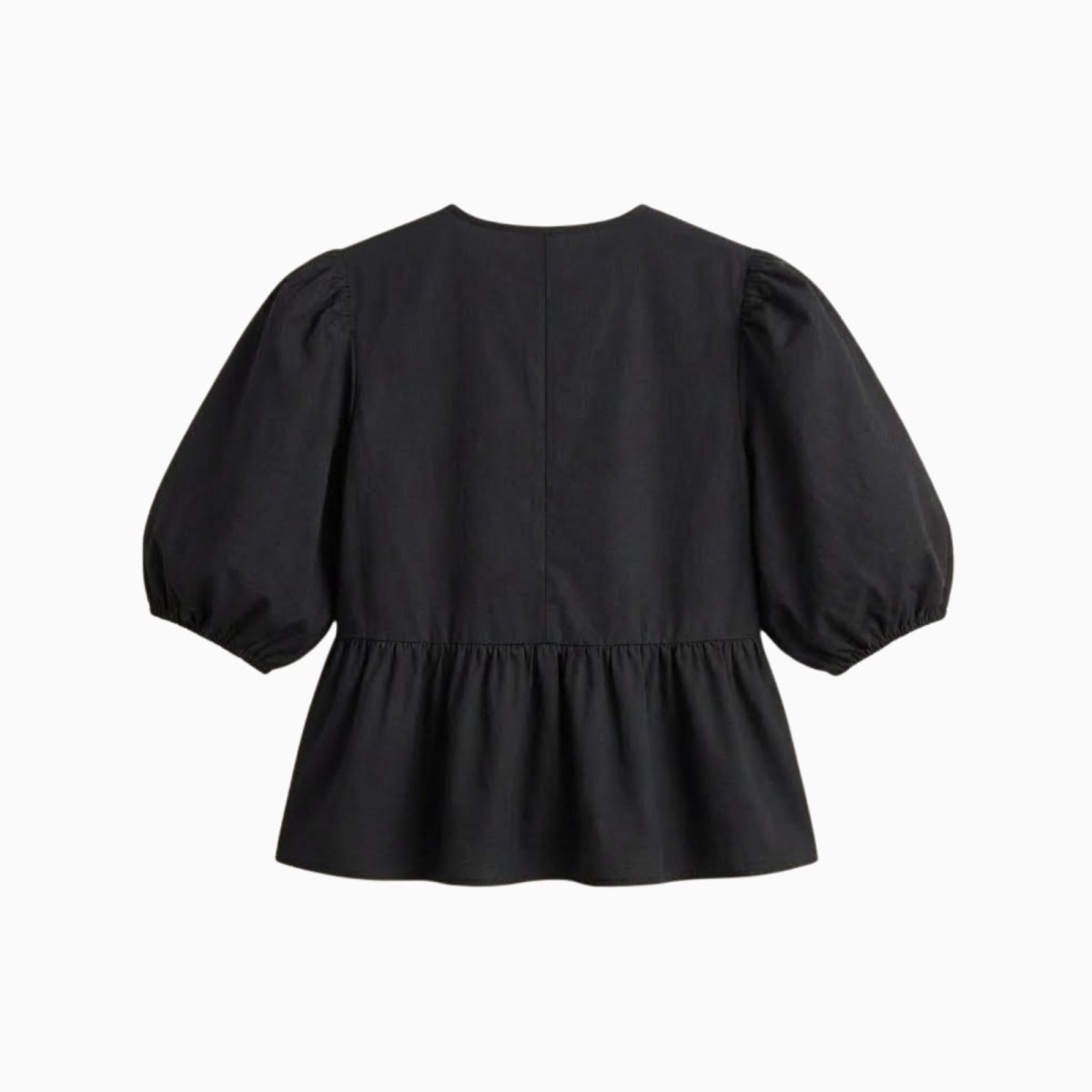 Flat lay showing the back of a black peplum blouse with short puff sleeves, highlighting the clean design.