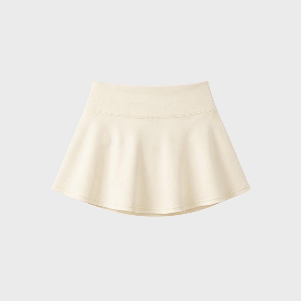 Close up back view flat lay of Kouvr apricot flared luxury tennis skirt activewear piece