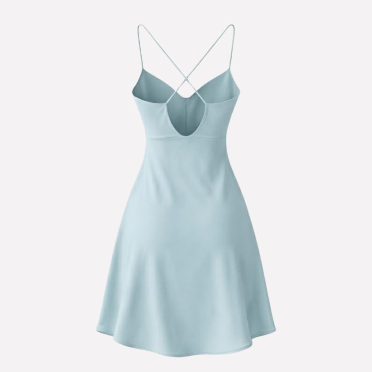 Flatlay photo of the back of the Kouvr Ariadne light blue satin slip dress, detailing the low back and criss-cross spaghetti straps.