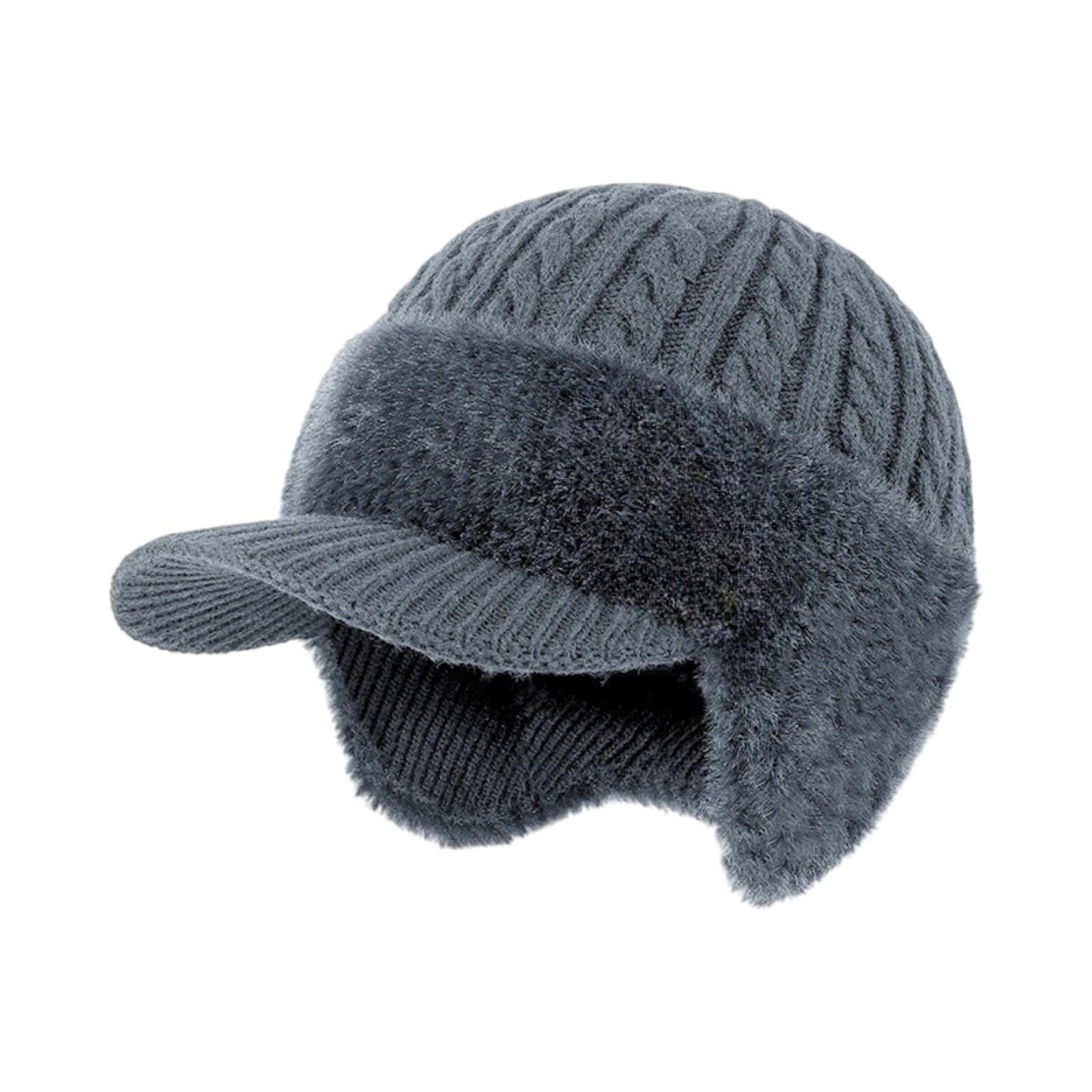 Kouvr Aspen cable knit trapper hat in heather grey with faux fur lining and integrated visor on a white background.