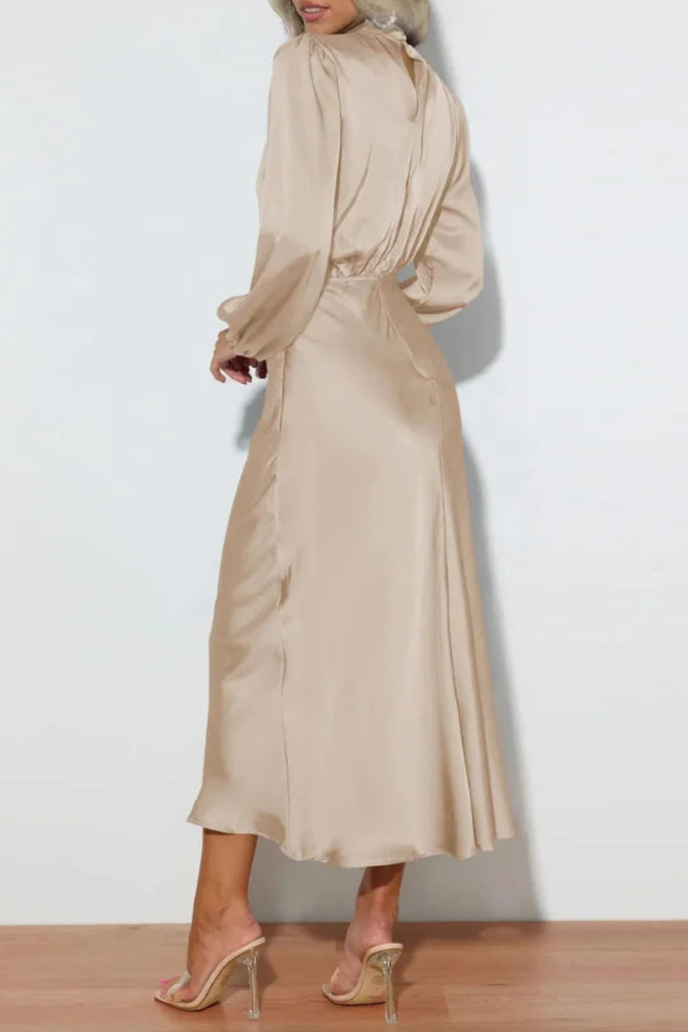 Model wearing Kouvr long sleeve beige satin midi dress with draped cowl neckline