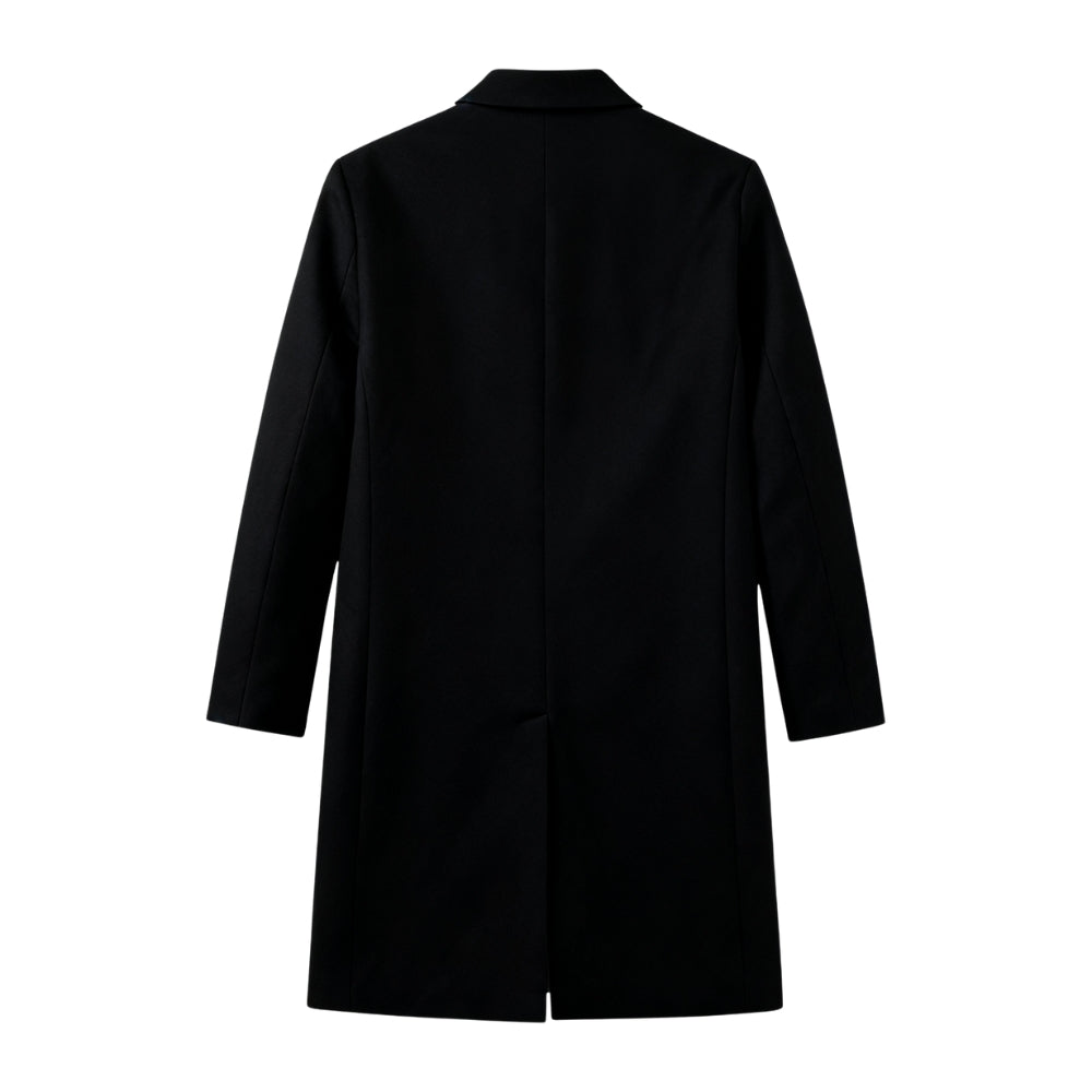 Man wearing a black Kouvr coat on a white background