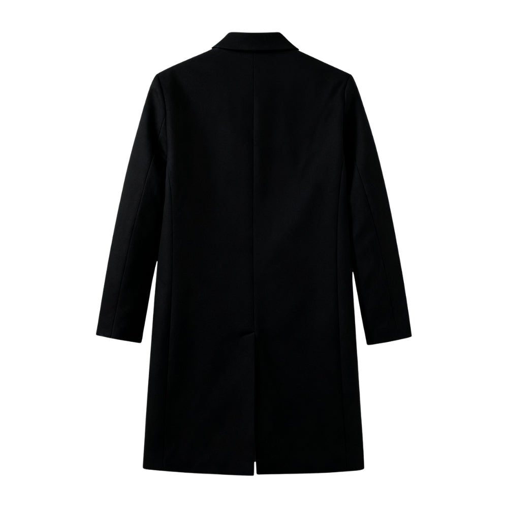 Man wearing a black Kouvr coat on a white background