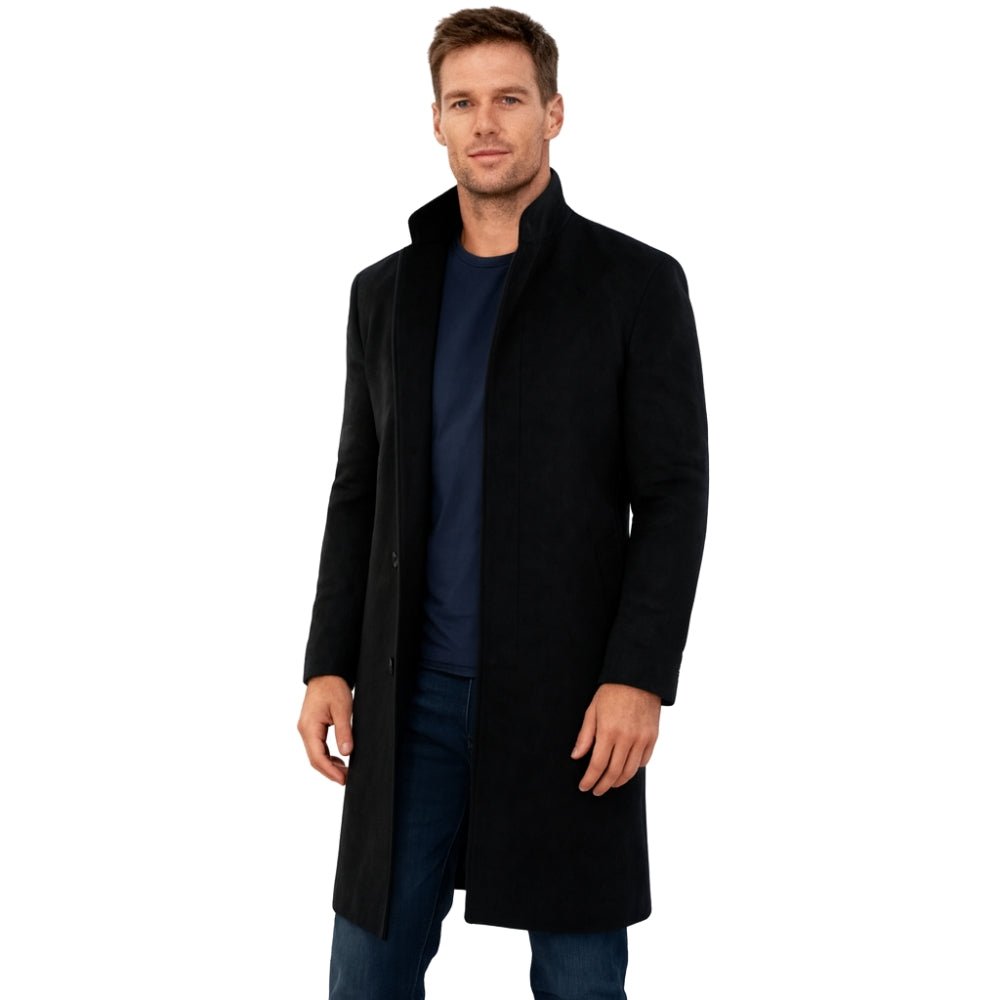 Man wearing a black Kouvr coat on a white background