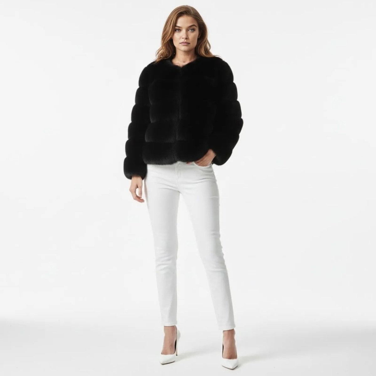 Model wearing the Kouvr black faux fur cropped jacket with white jeans, facing forward.