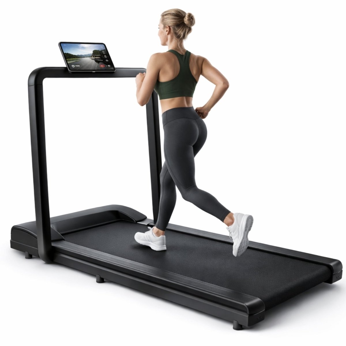 Side profile of woman running on black Kouvr space-saving cardio treadmill against white studio background