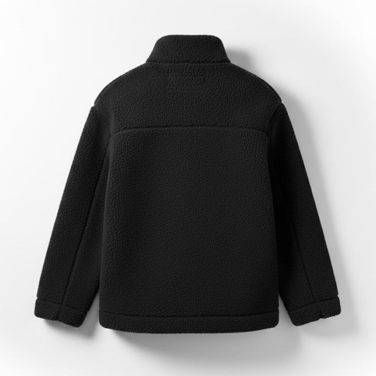 Back view flat lay of the Kouvr black sherpa jacket, detailing the back panel seam and overall construction.