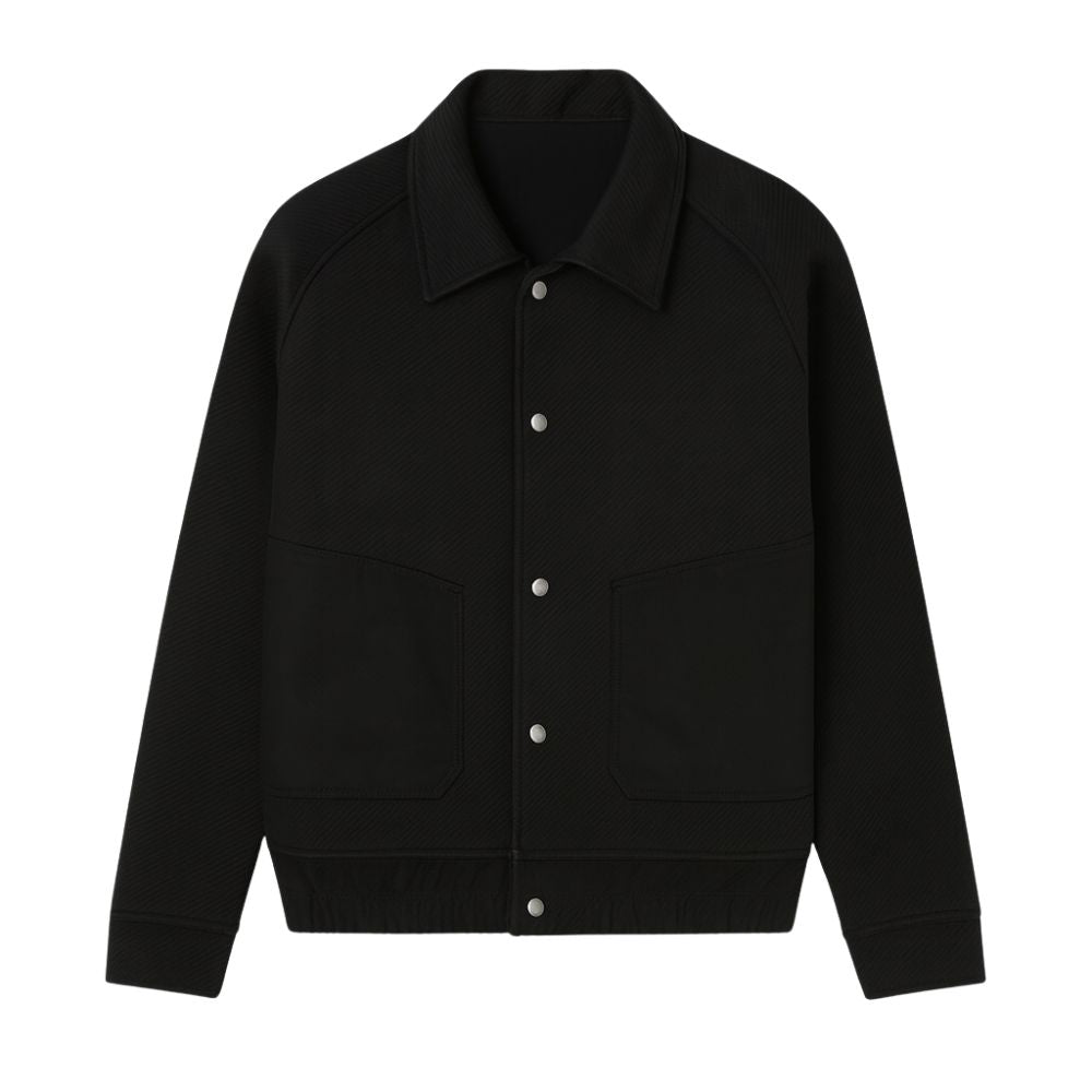 Model wearing the Kouvr men's black textured corduroy and nylon trucker jacket