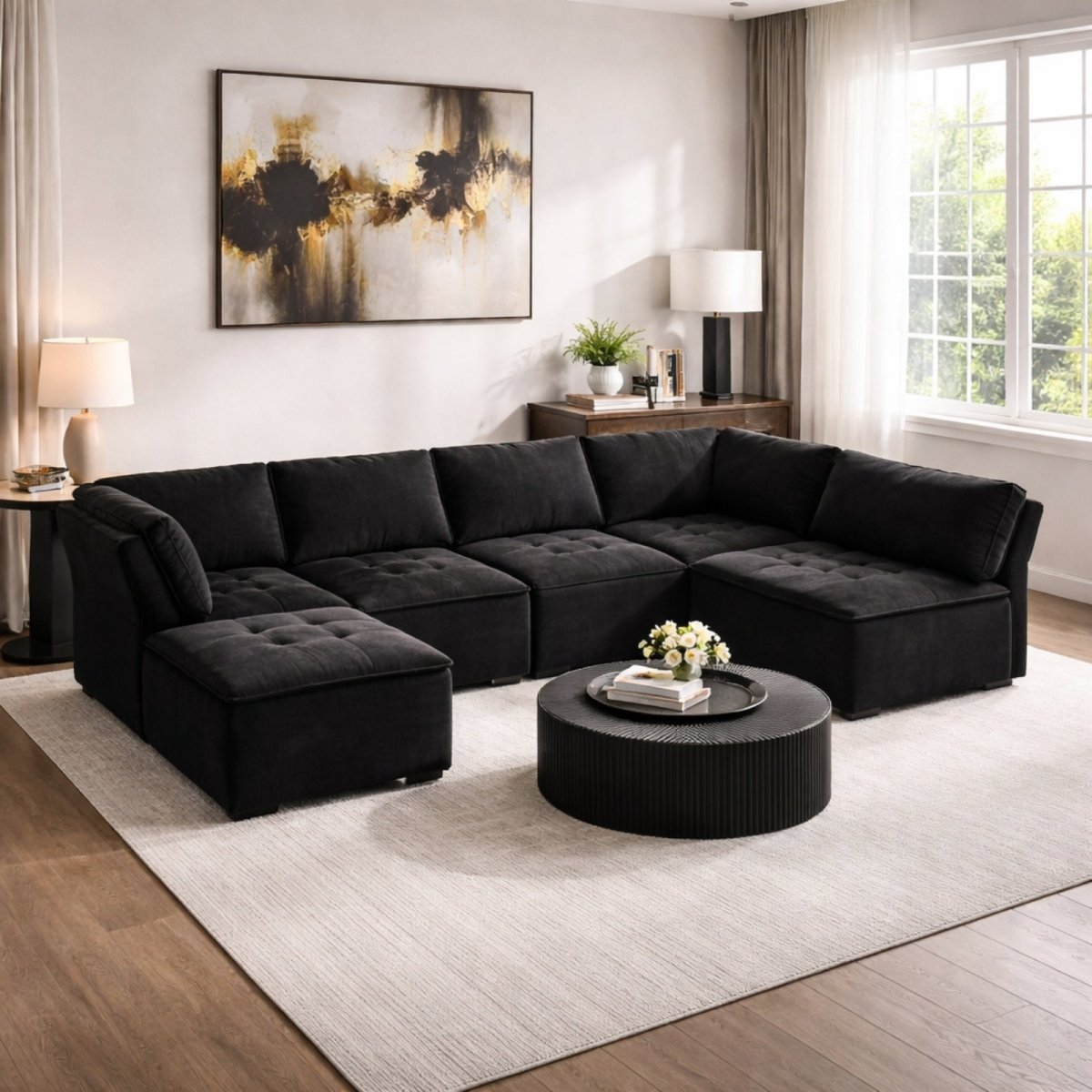 Sophisticated black corduroy modular sofa in a dark interior setting, highlighting the biscuit-tufted cushions and modern low-profile design.