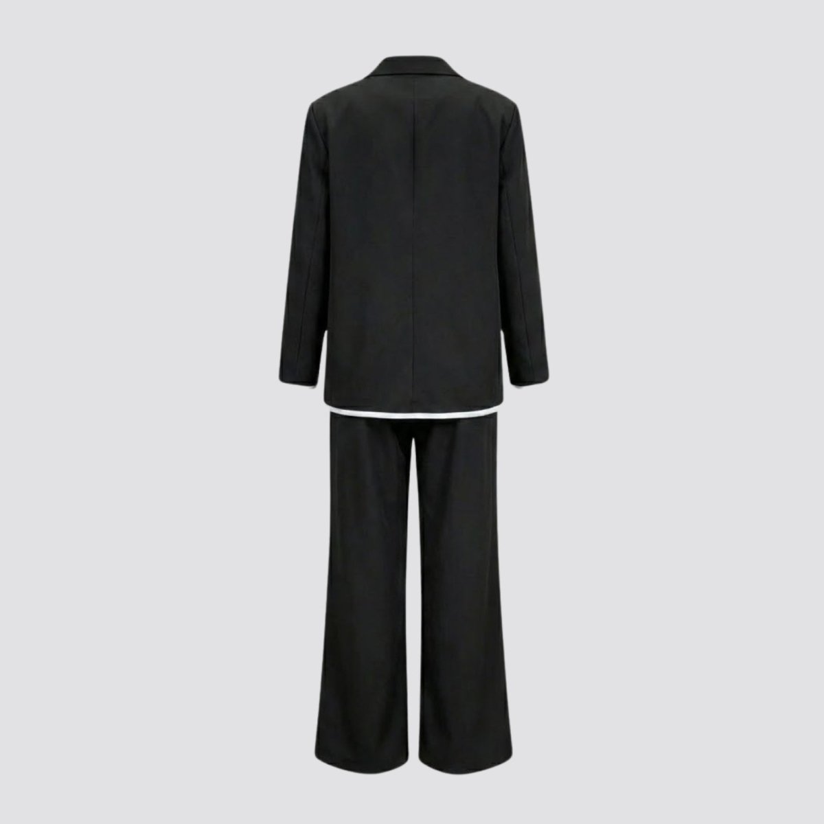 Flatlay of the back of the Kouvr black pantsuit, displaying the reverse side of the blazer and trousers to show construction and details.