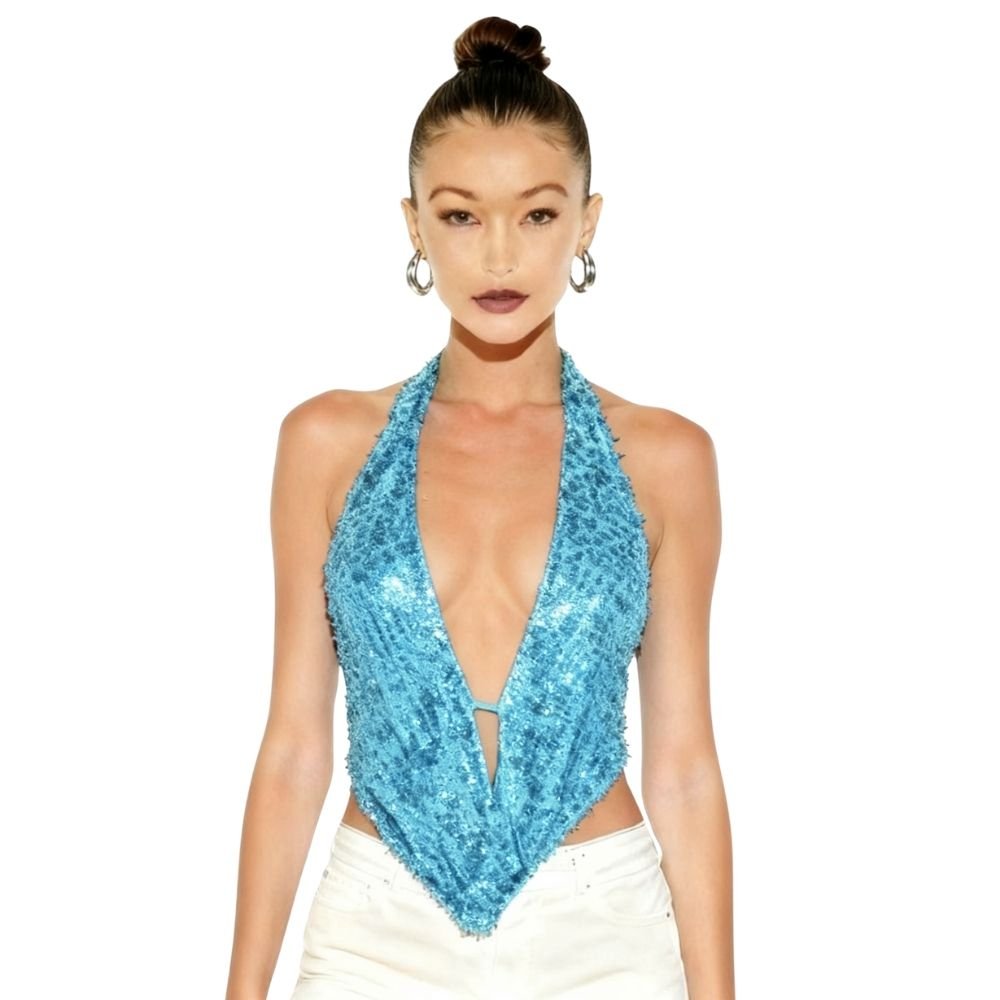 Woman wearing a blue  kouvr sequin halter top on a white background