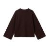 Flat lay of the Kouvr oversized dark brown sweater showcasing its wide sleeves and crewneck.