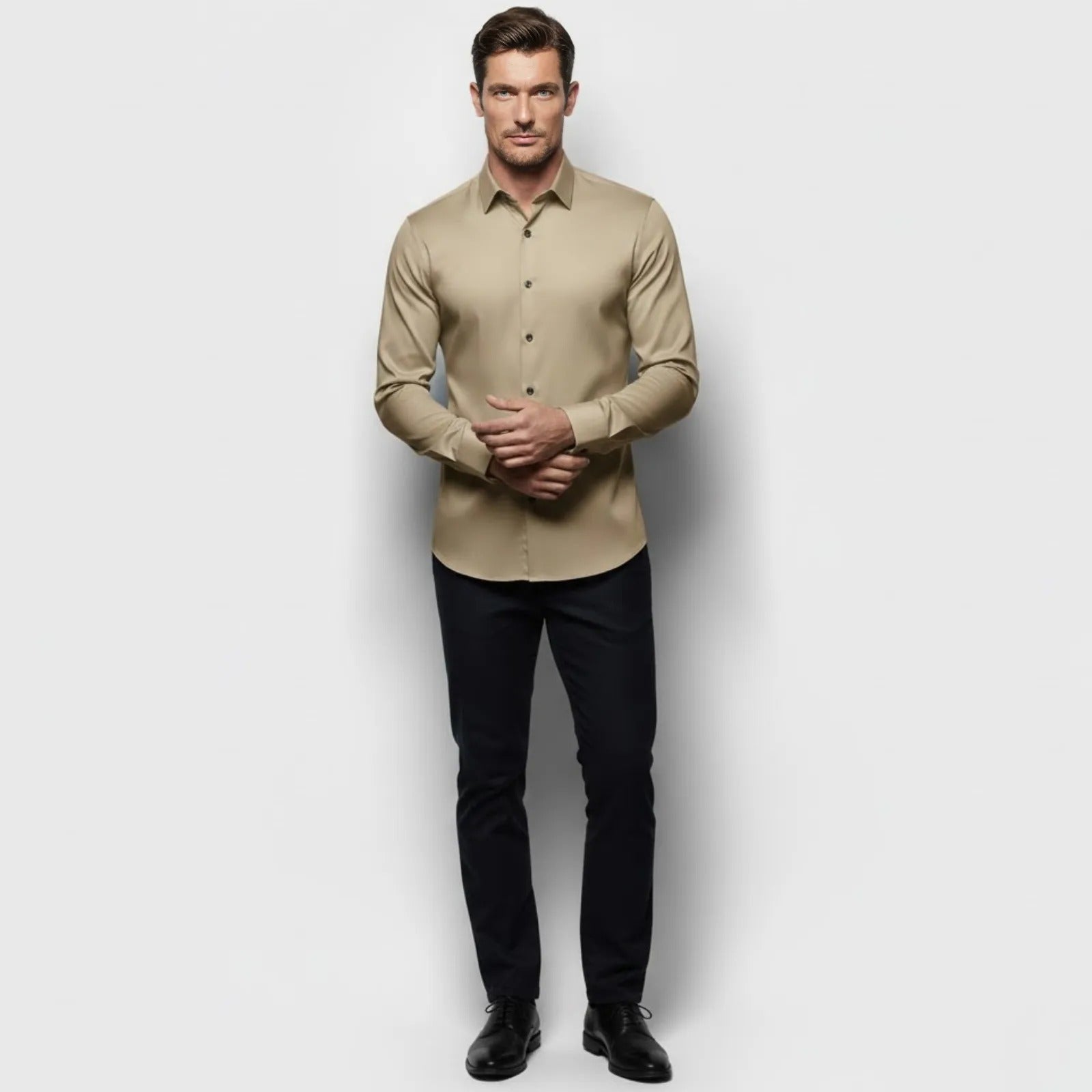 Male model wearing the Kouvr Briar khaki slim fit performance dress shirt with black trousers, showing the front view.