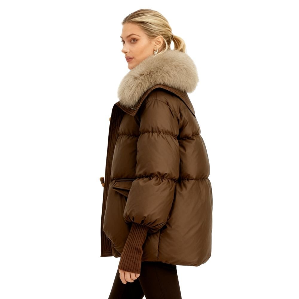 Brown kouvr puffer jacket with fur hood worn by a model on a white background