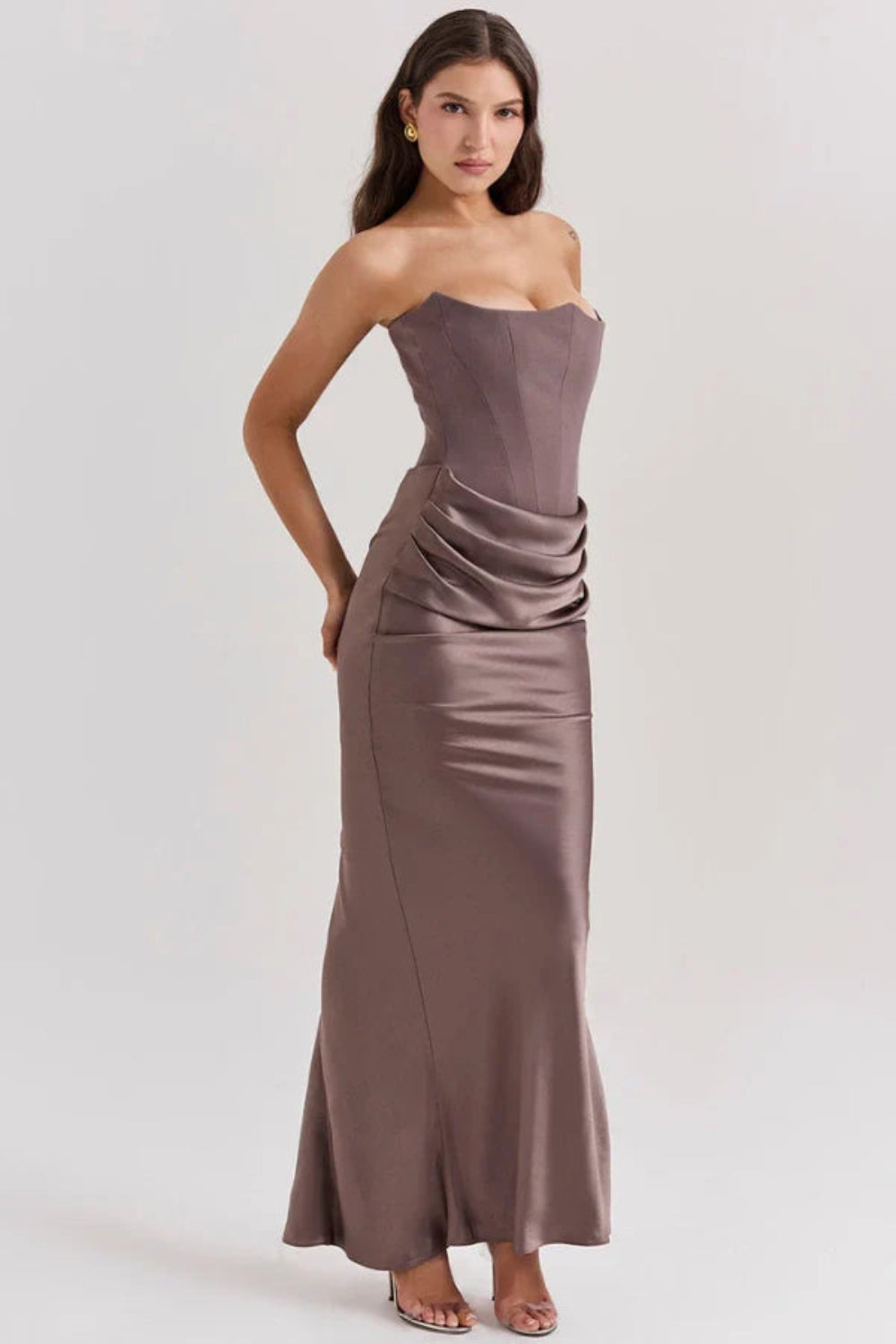 sculptural," "figure-flattering," "boned bodice," "ruched hip detail," and "black-tie attire