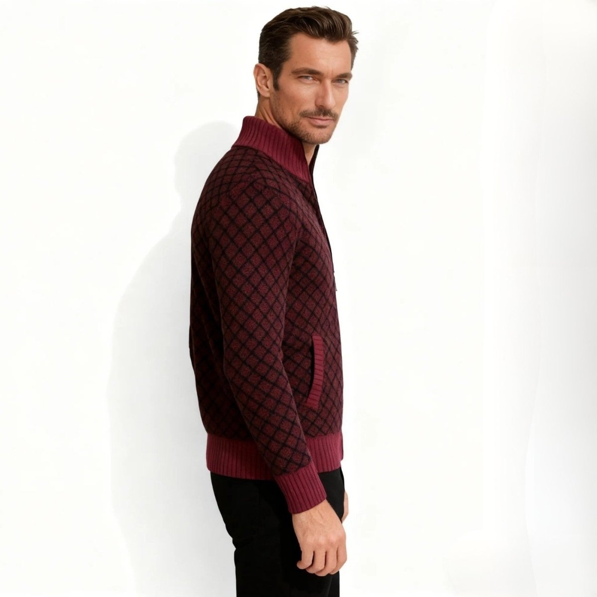 Side profile of a model in the Kouvr Asti luxury merino wool funnel neck cardigan in a burgundy diamond jacquard knit.