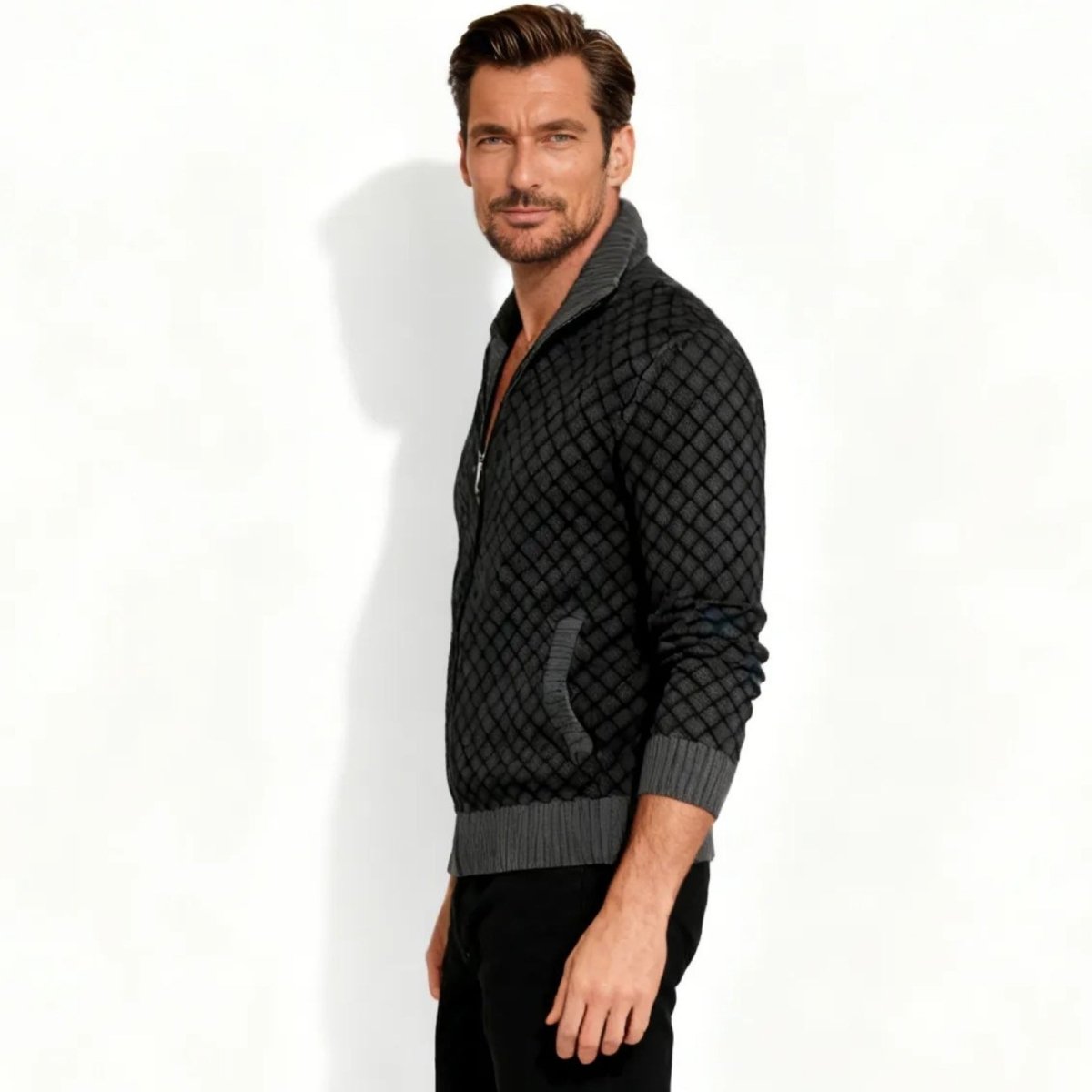 Side profile of a man in the Kouvr Argento charcoal full-zip cardigan showing the fit and sleeve detail.