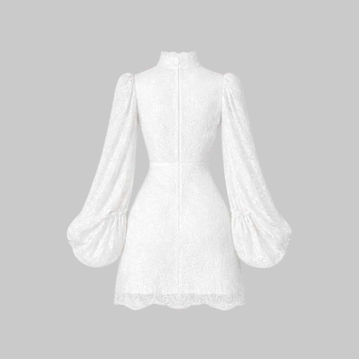 Flat product shot of the back of the Cassie white lace mini dress, showing the zipper and seam details.