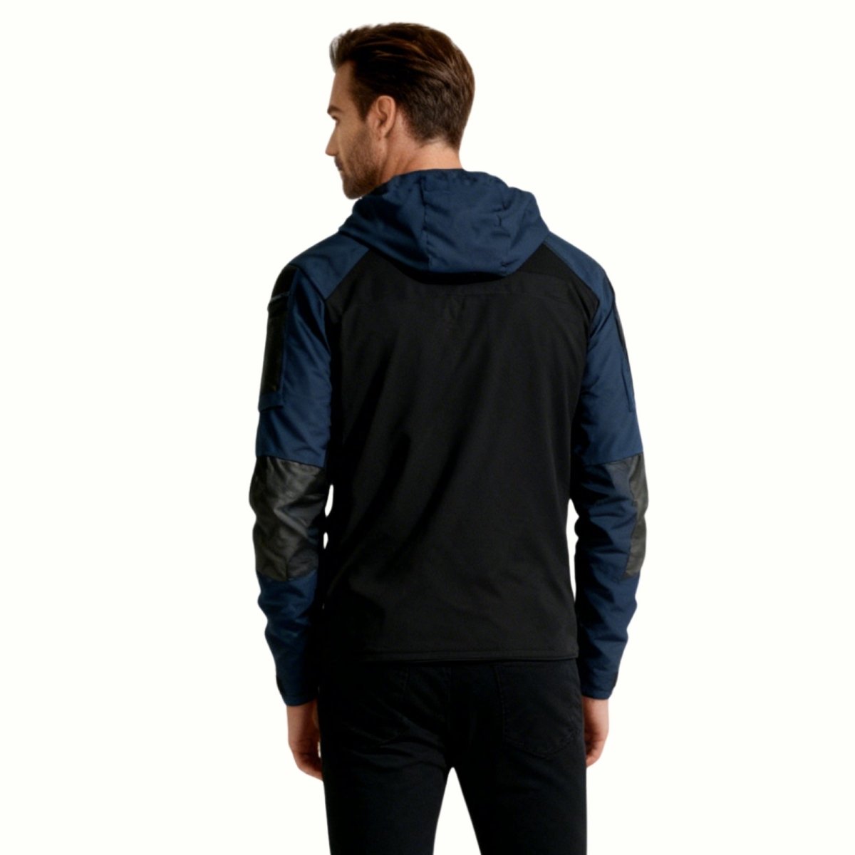 Rear view of a man in the Kouvr Clint tactical hoodie, displaying the color-block design and fit across the shoulders and back.