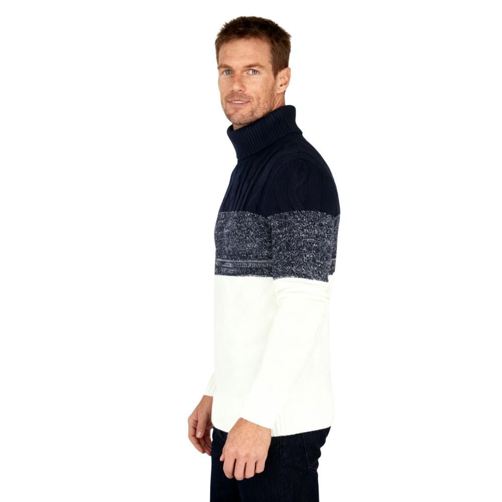 Man wearing a navy and white kouvr sweater on a white background