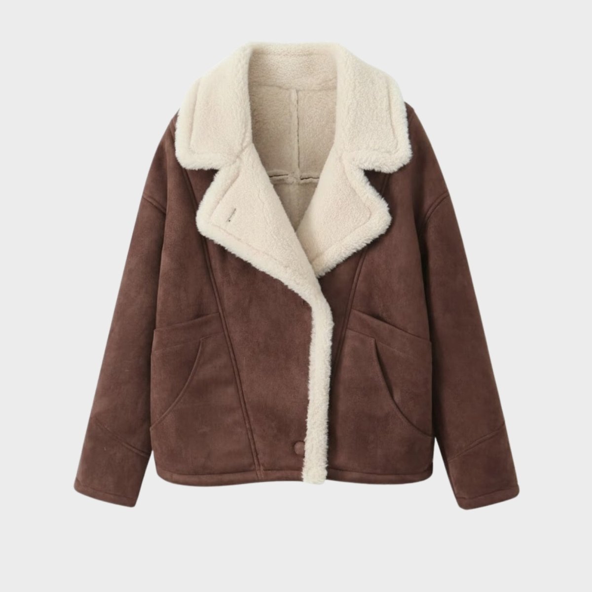 Product flatlay of the Kouvr dark brown faux shearling jacket showing the plush white sherpa collar and lining.