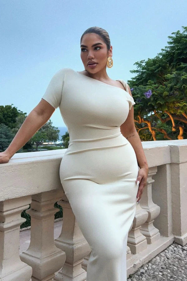 Naturally include related terms like `sculptural silhouette`, `figure-hugging`, `single sleeve gown`, `elegant formalwear`, and `resort evening dress